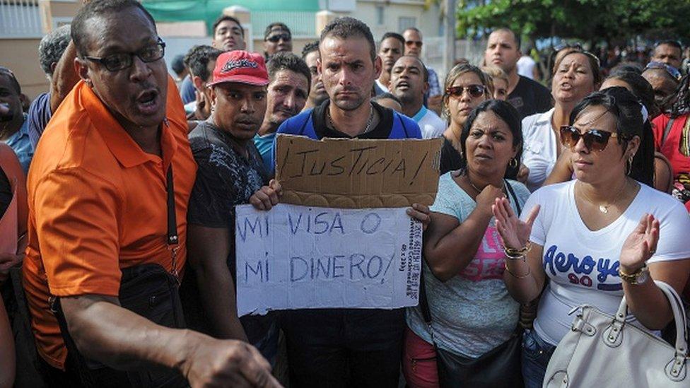 Cubans rally in front of the Ecuadorean embassy in Havana over new visa restrictions designed to stop Cuban migrants travelling through the region to the US