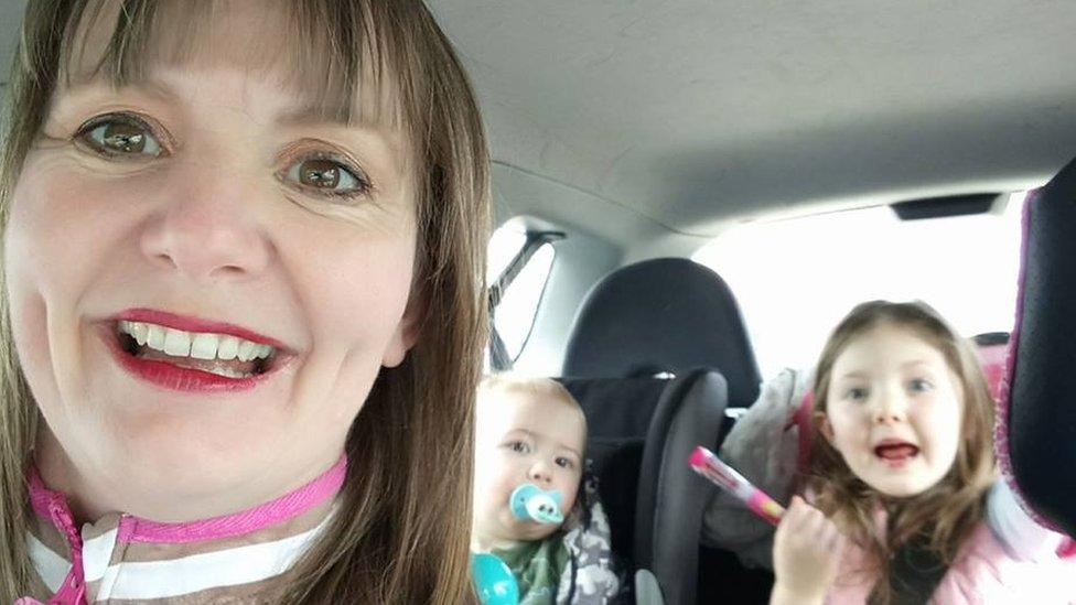 Sam McConnell with her children in a car