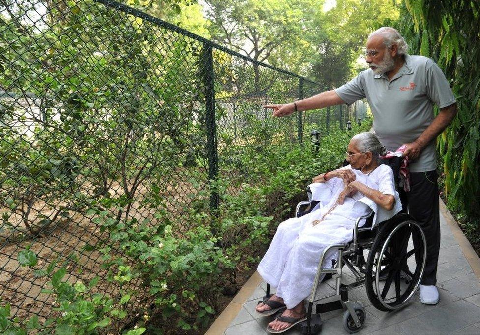 Prime Minister Narendra Modi with his mother Hiraba at the 7RCR in New Delhi during the latter's first visit to the PM's residence.