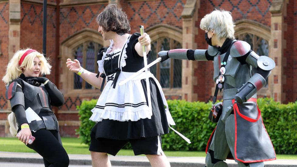 Three QCon attendees play fighting