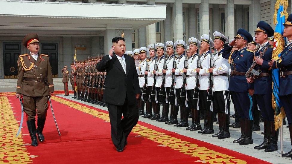 This April 15, 2017 picture released from North Korea's official Korean Central News Agency (KCNA) on April 16, 2017 shows North Korean leader Kim Jong-Un (C) arriving for a military parade in Pyongyang marking the 105th anniversary of the birth of late North Korean leader Kim Il-Sung. /