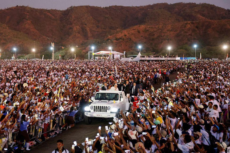 Pope Francis greets people from a car after leading a Holy Mass at the Esplanade of Tasi Tolu in Dili, East Timor, September 10, 2024. 