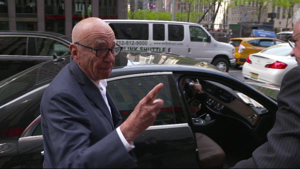 Rupert Murdoch answers questions outside his New York offices