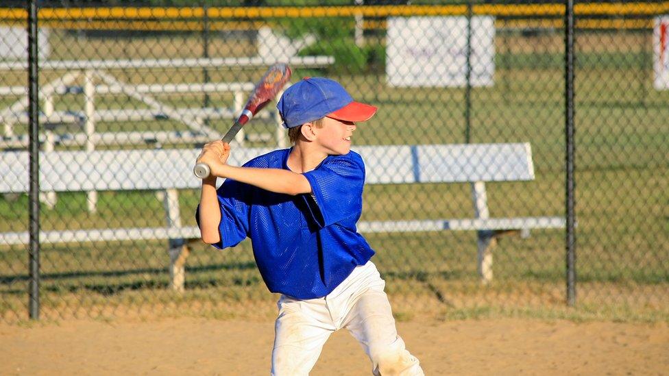 A boy plays baseball