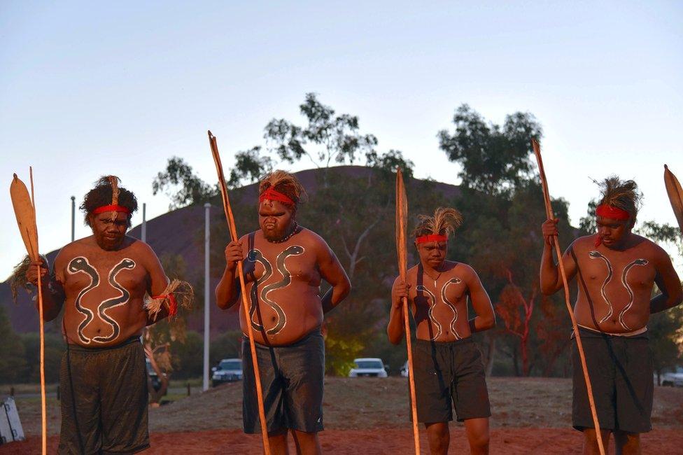 Local performers dance during the summit's opening ceremony