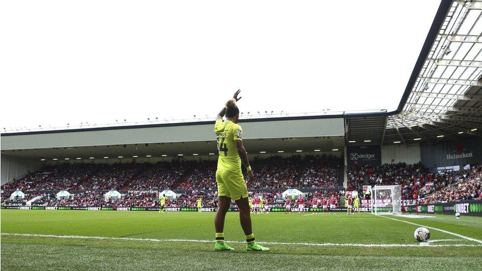 A Huddersfield player prepares to take a corner against Bristol City at Ashton Gate