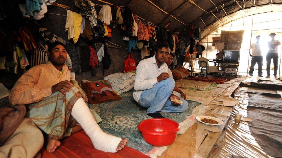 Migrant workers recover from gunshot wounds in makeshift housing at a strawberry plantation near the village of Nea Manolada, Greece, 18 April, 2013