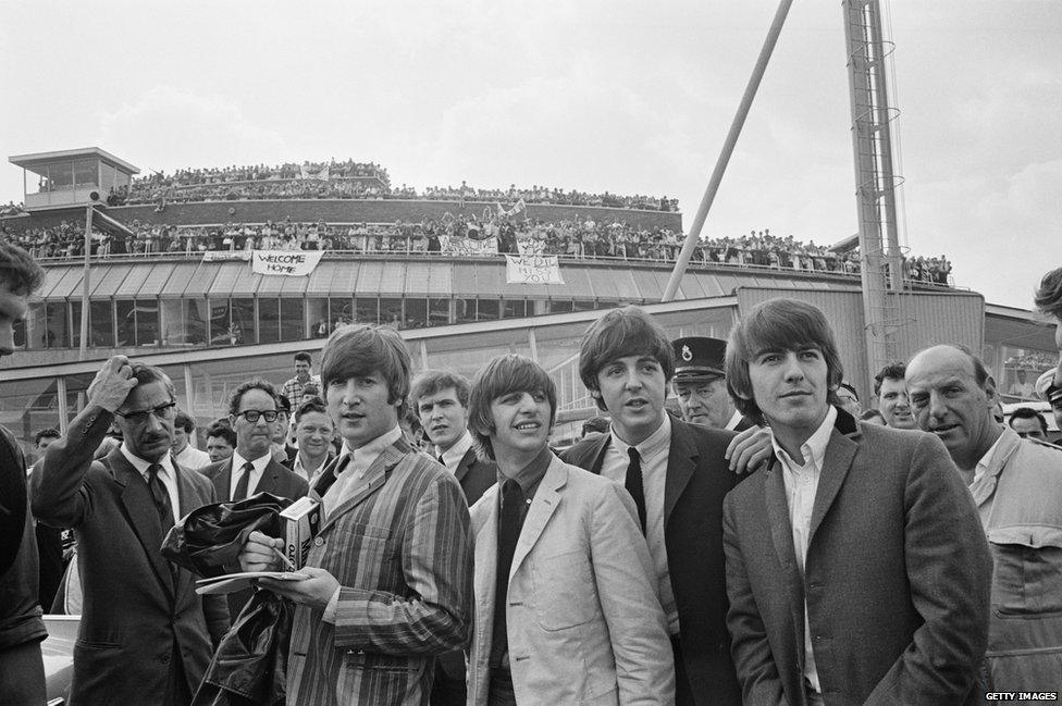 The Beatles arrive at London Airport after a flight from Stockholm in Sweden, 30 July 1964