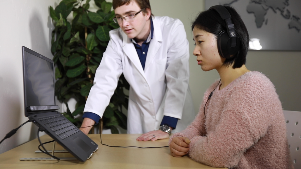 A woman undergoing an EyeDetect test