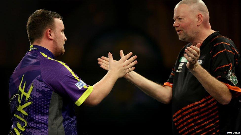 Luke Littler (left) is congratulated by his idol Raymond van Barneveld