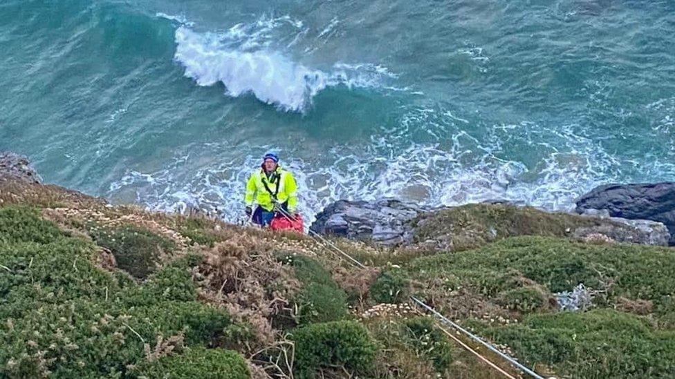 Cliff technician on cliff face