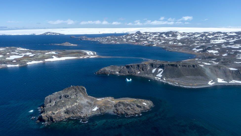 : Aerial view from Chilean Air Force helicopter shortly after taking off towards Comandante Ferraz Station, on December 19, 2019 in King George Island, Antarctica.