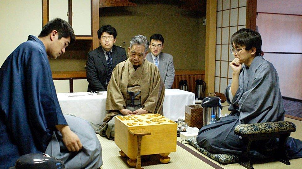 A file photo of shogi players competing in a master tournament