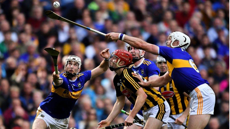 Tipperary players Brendan Maher, left, and Padraic Maher, right, try to gather possession as James Maher of Kilkenny looks on during the GAA Hurling All-Ireland Senior Championship Final match between Kilkenny and Tipperary at Croke Park in Dublin