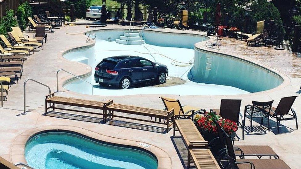 A car sitting in the bottom of an empty swimming pool in Colorado Springs - 3 July 2017