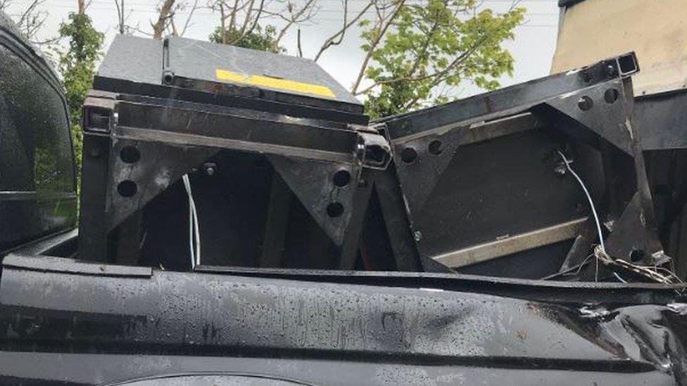 Cash machines loaded in the back of a pick-up style truck