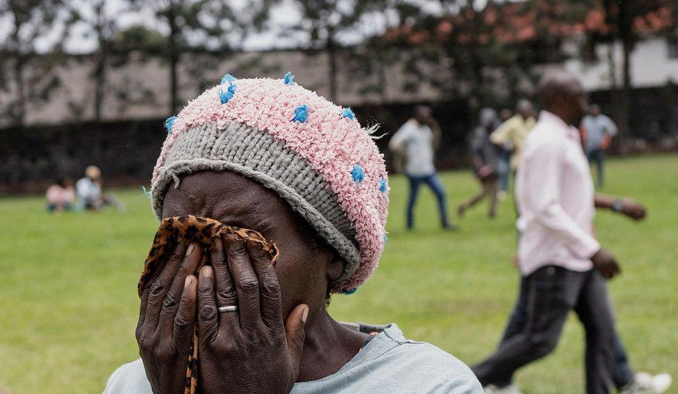 A woman reacts after her family member died - Thursday 3 October 2024