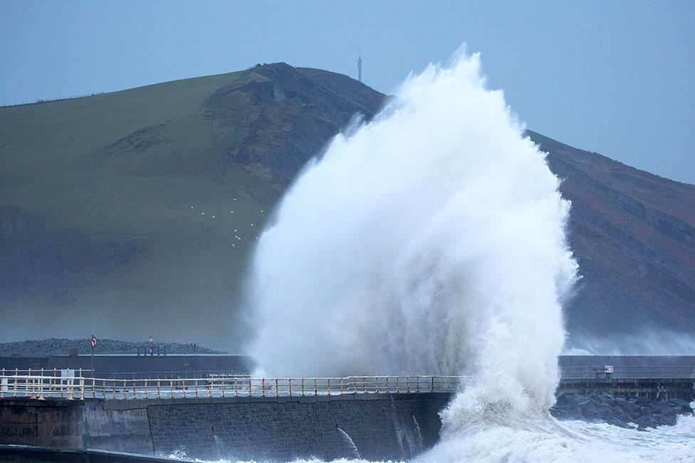 Storm Eunice and rough seas bring huge crashing waves along Aberystwyth promenade