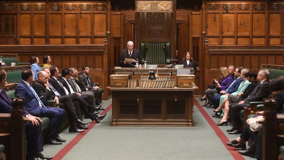 MPs sit in the house of commons