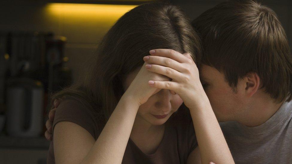 Young woman being comforted