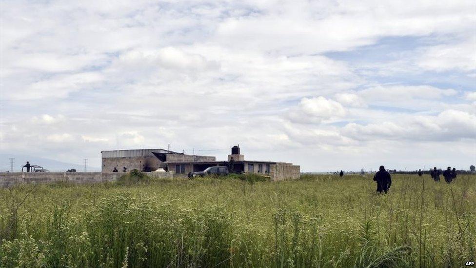 Policemen and soldiers check a house used by Joaquin Guzman to escape from the Altiplano prison on 12 July, 2015.