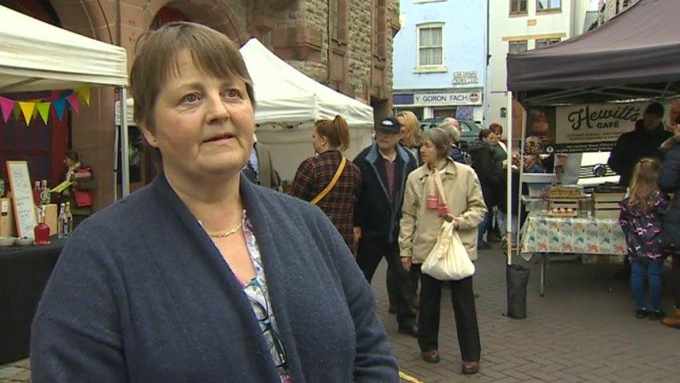 Nia Williams surrounded by stalls in Denbigh town centre