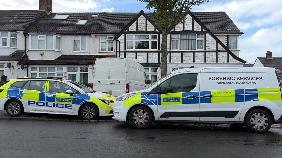 Police vans outside house