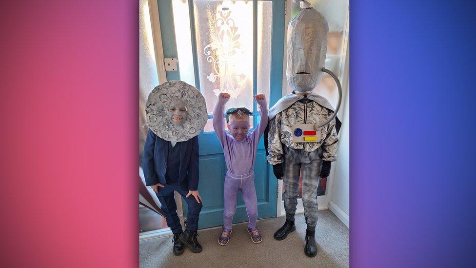 three kids dressed up