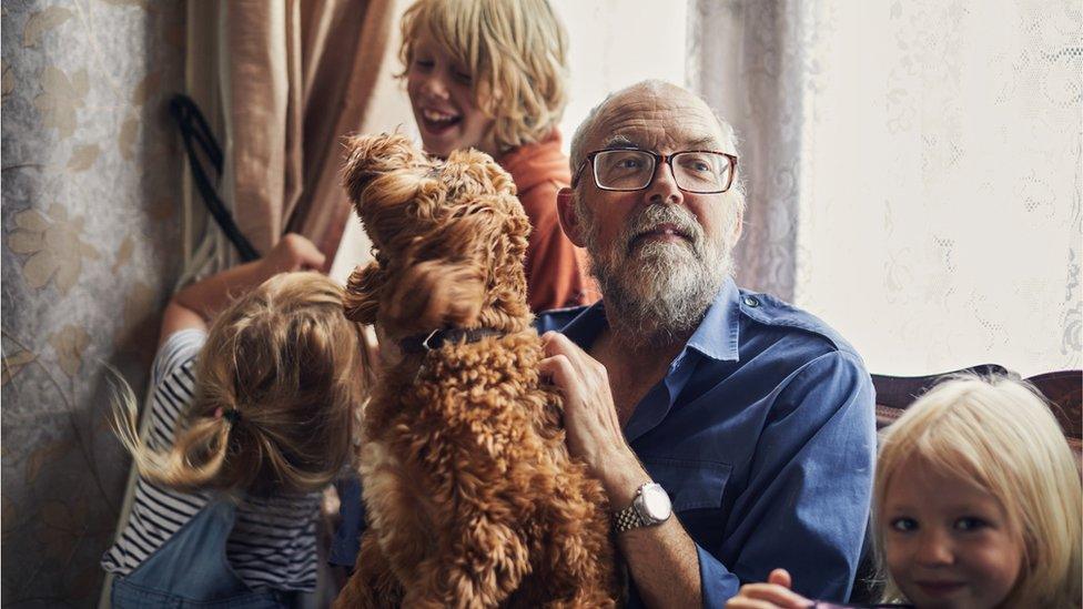 Extended household including grandfather and grandchildren