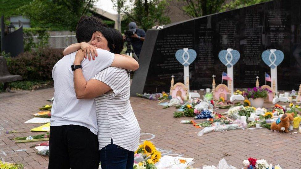 Mourners at a makeshift vigil