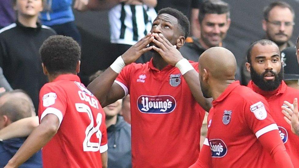 Omar Bogle celebrates