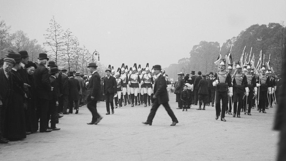 Soldiers from the Household Cavalry and another regiment marching