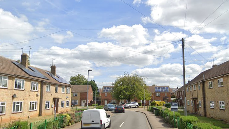 A street view of Mendip Grove showing buildings either side of the road