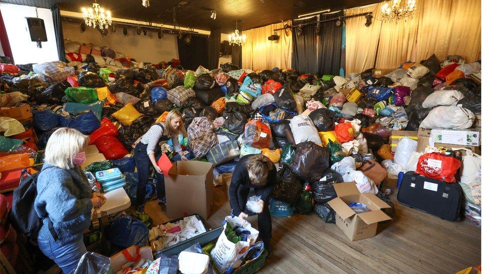 Volunteers sort through donations at the White Eagle Club