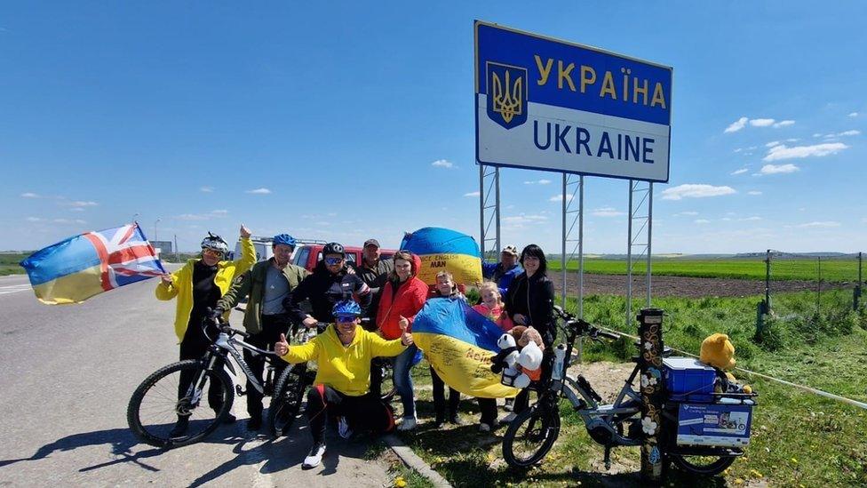 Karol Swiacki and Laurie Robertson with their support team on the Ukraine border