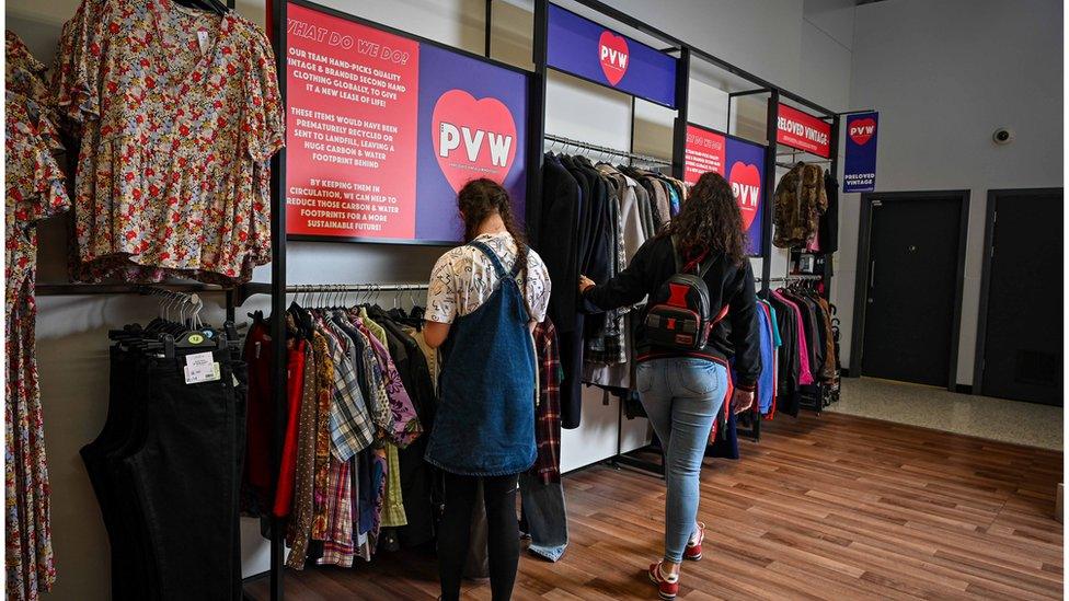 Women browsing vintage clothes