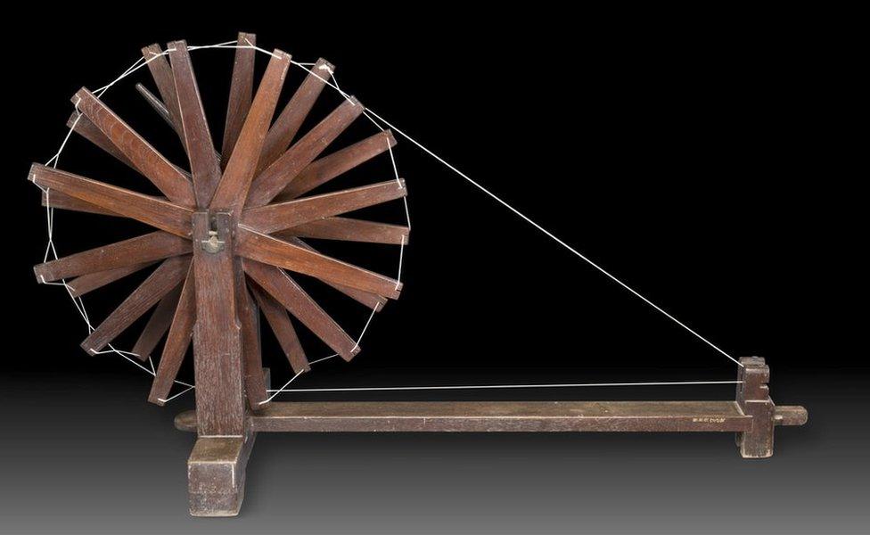 A wooden charkha or spinning wheel