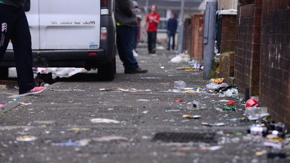 Broken glass and litter in the Holyland area of Belfast after St Patrick's Day