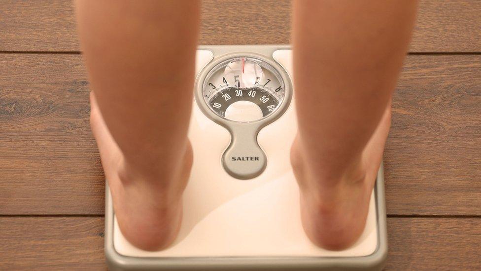 Child standing on scales