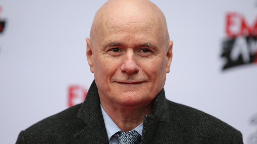 British actor Dave Johns poses on arrival for the Three Empire awards in London on March 19, 2017