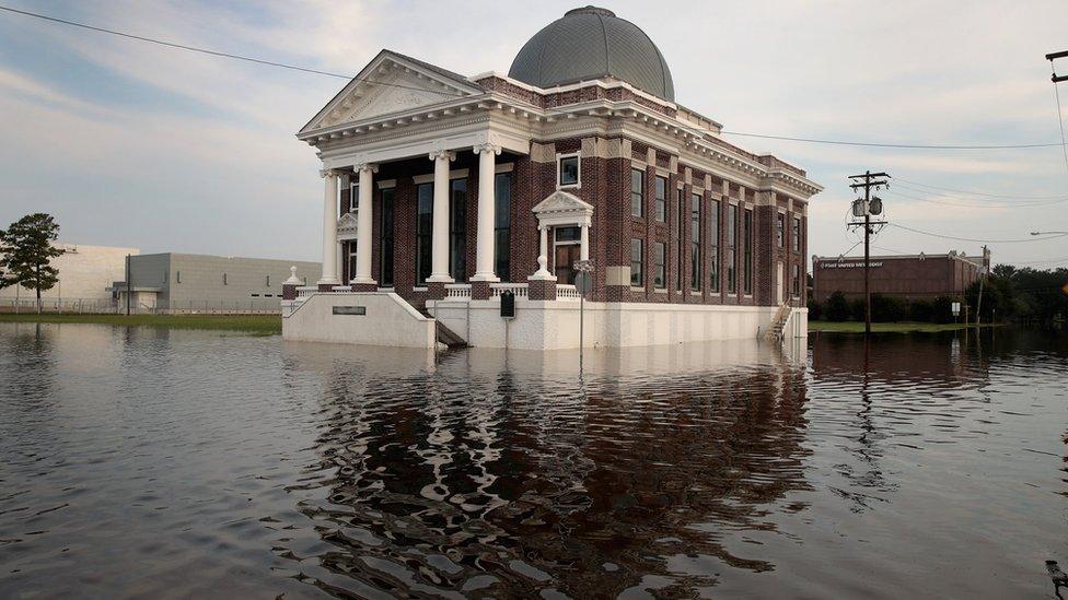 Floodwater surrounds a Baptist church in Texas