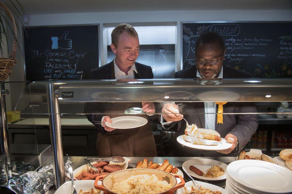 Tim Farron and Ade Adeyemo, local candidate for Solihull, make breakfast for visiting journalists at Cafe Shirley, a German cafe in Solihull.