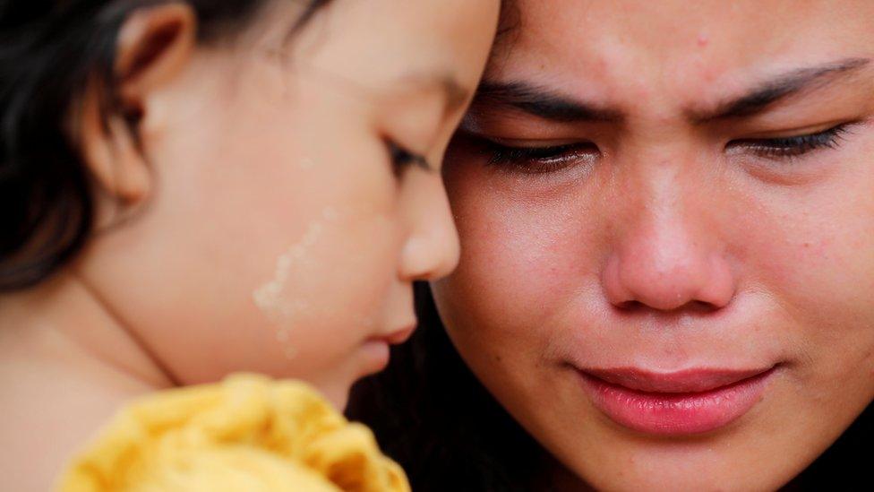 Kyaw Soe Oo"s wife, Chit Suu Win, and daughter, Moe Thin Wai Zan