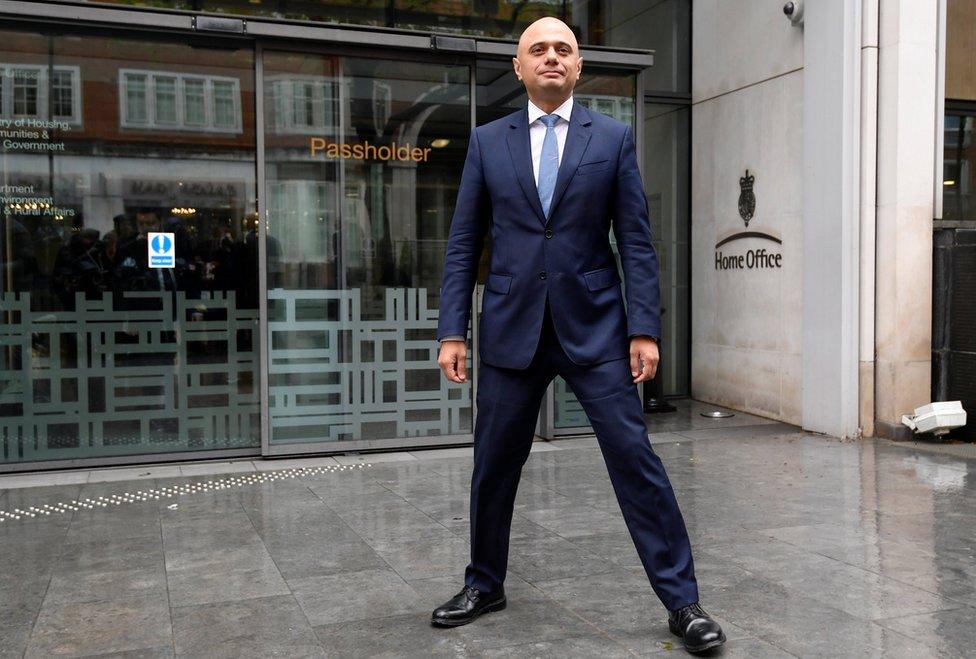 Sajid Javid stands in power pose