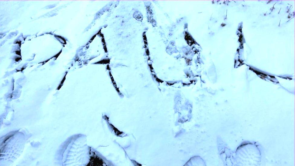 Man's name in snow