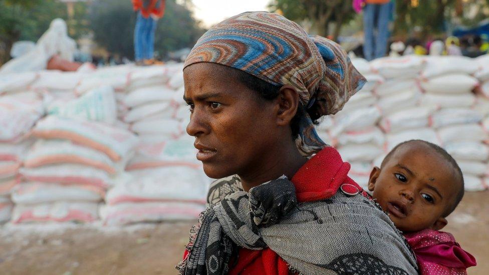 Woman queues for food at a temporary shelter in Tigray (file pic - March 2021)