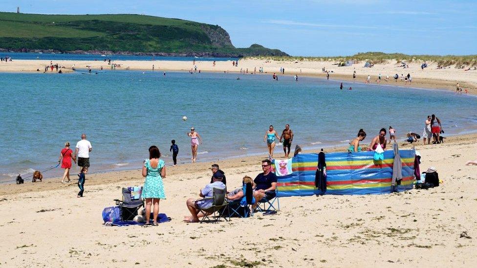 Holiday-makers on the beach on July 12, 2020 in Rock, United Kingdom