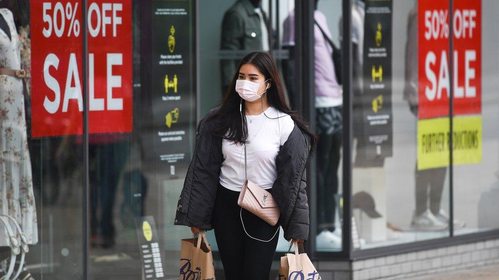 Shopper in street with face mask