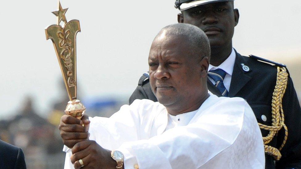 President Mahama raises a staff during his inauguration on 7 January, 2013.