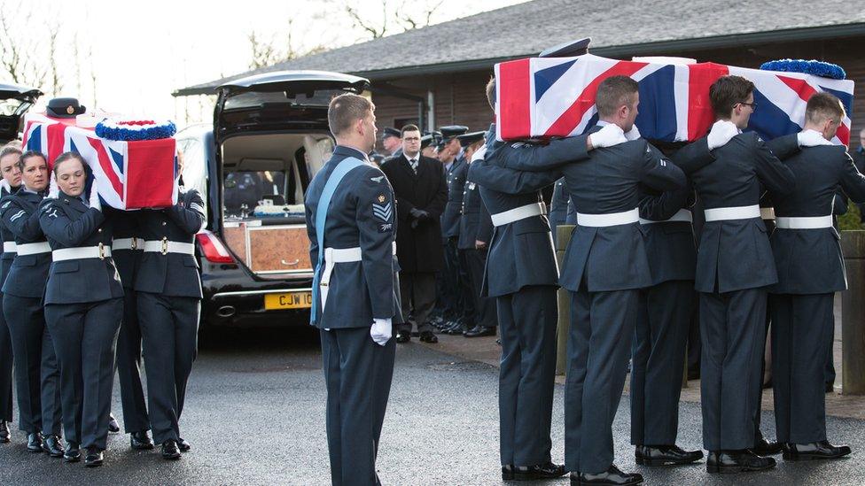 Coffins are carried into the crematorium during the funeral of 101-year-old Dambusters engineer Victor and his wife Edna Barnett from Telford